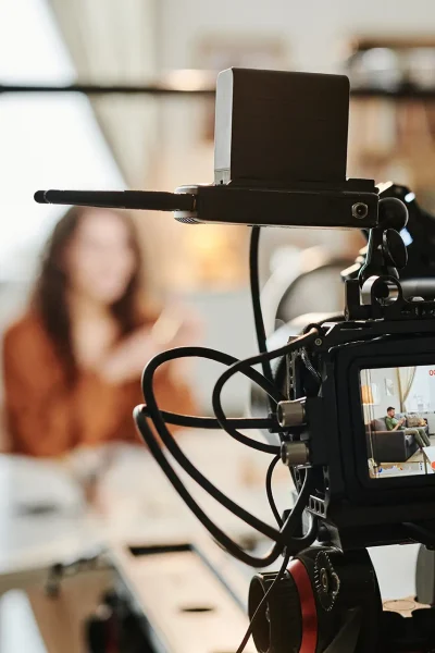 video-camera-with-young-female-blogger-or-advert-m-2022-05-03-23-09-35-utc
